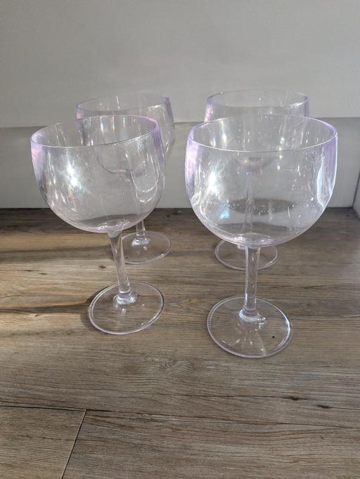  — 4 plastic gin glasses
