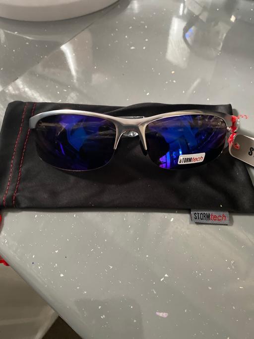  — Storm wrap around sunglasses with pouch