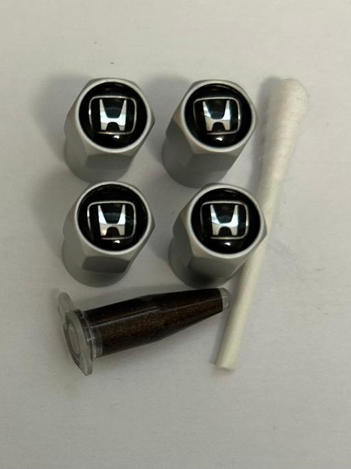 — Honda tyre valve caps with grease
