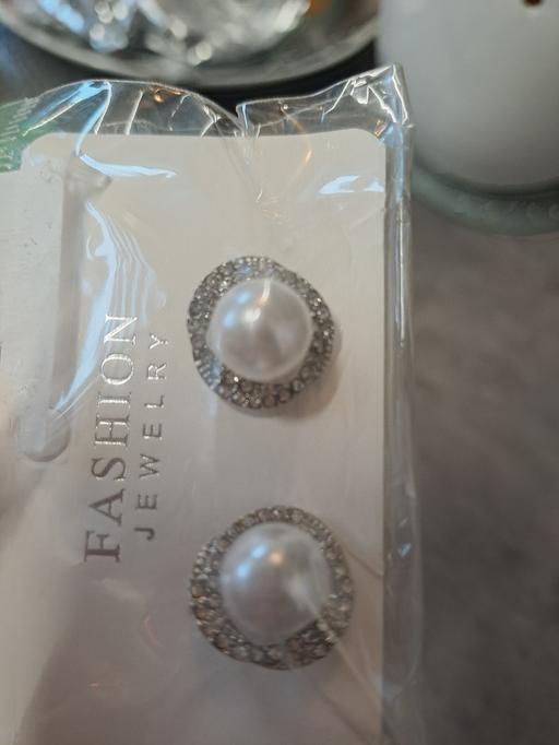  — new earings