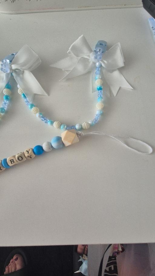 — pram charm with matching dummy clip