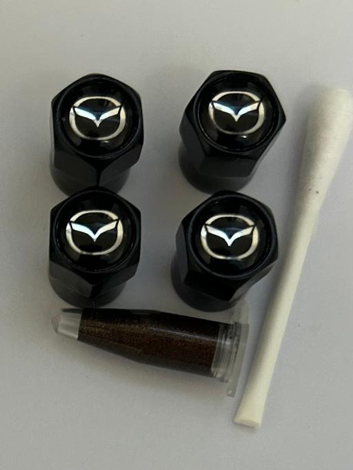  — Mazda Tyre valve caps with grease