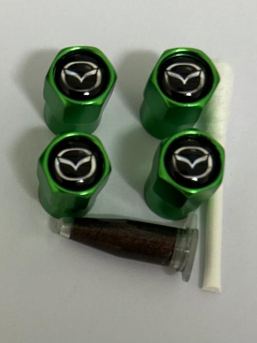 — Mazda Tyre valve caps with grease