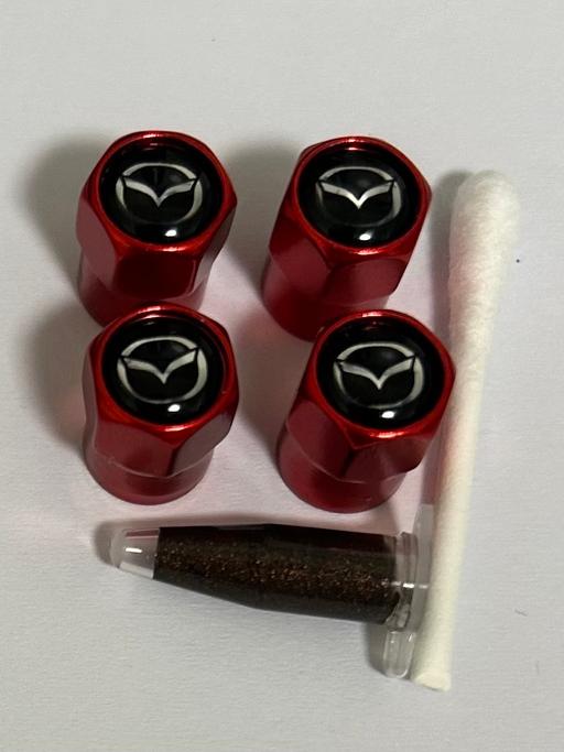  — Mazda Tyre valve caps with grease