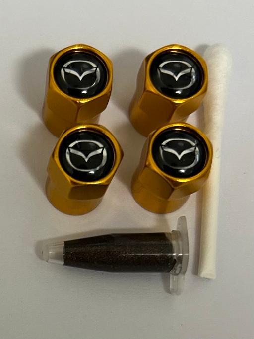  — Mazda Tyre valve caps with grease