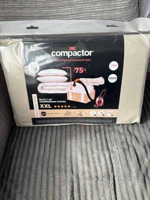  — Compactor vacuum box