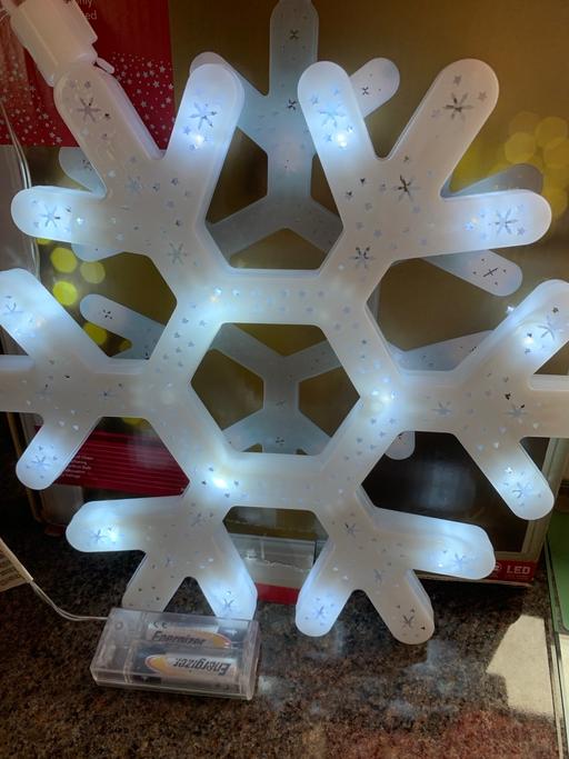  — Xmas light up snowflake buyer collect