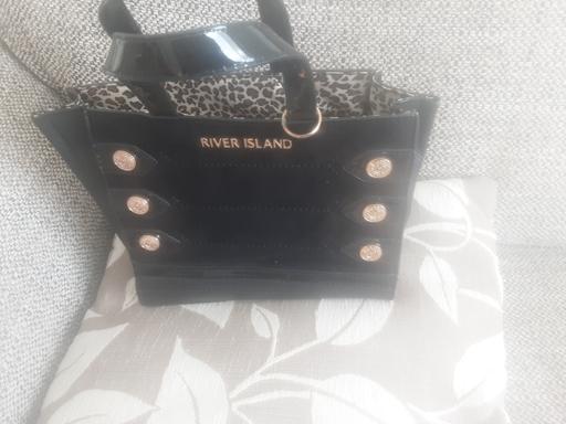  — Black River Island hand bag