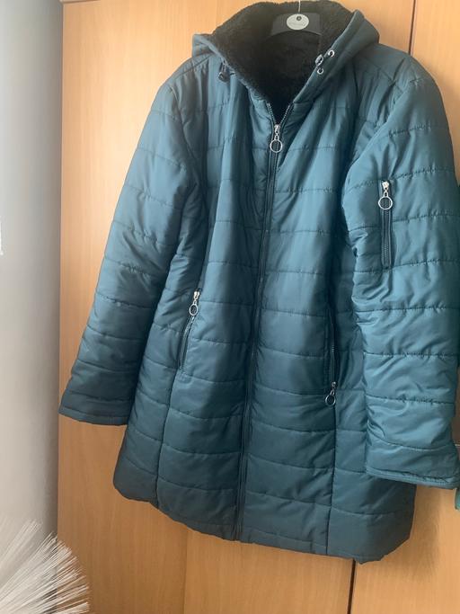  — Dark green fur lined coat winter coat only so