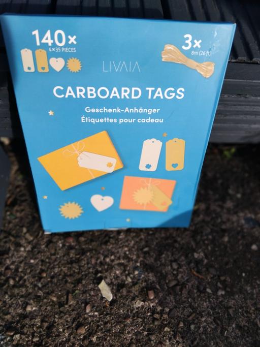  — cardboard tags with string