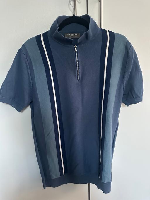  — Primary Navy blue striped polo shirt