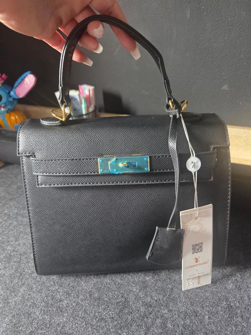  — handbag