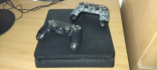  — playstation 4 with controllers