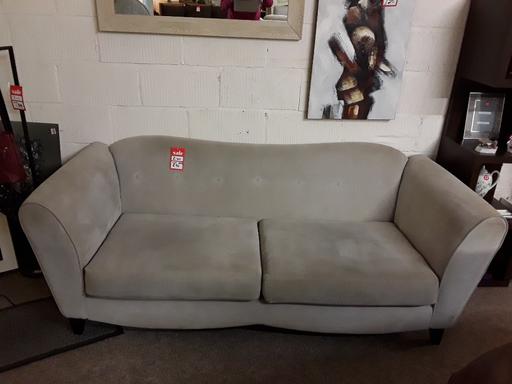  — DFS beige fabric three-seater sofa