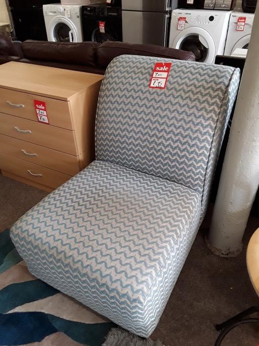  — Turquoise & cream patterned DFS chair