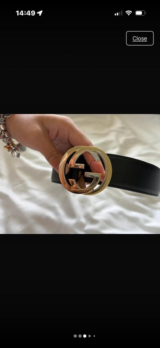  — Black gucci belt with interlocking gold buckl