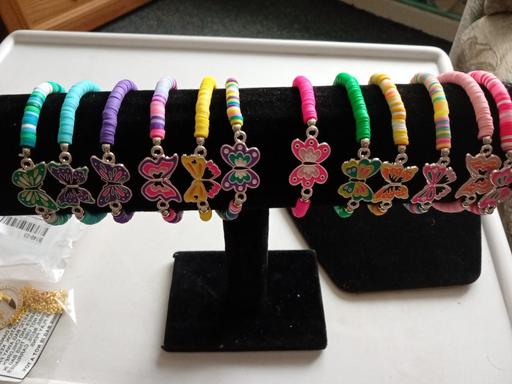  — new pack of 12 butterfly design bracelets