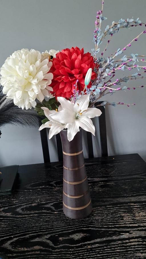  — Brown vase and flowers