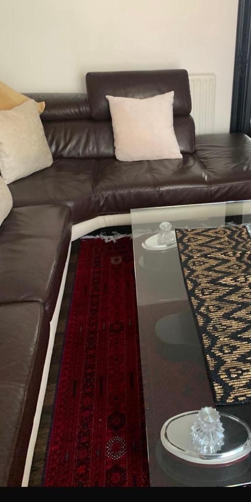  — Brown and cream sofa