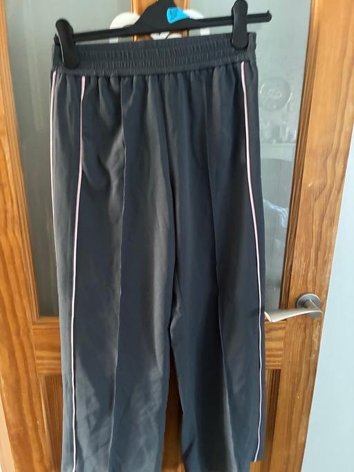  — Grey trousers