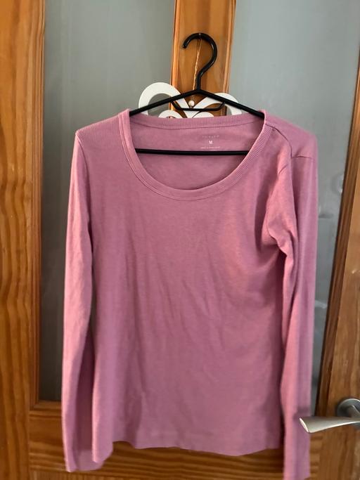  — Pink long sleeve top