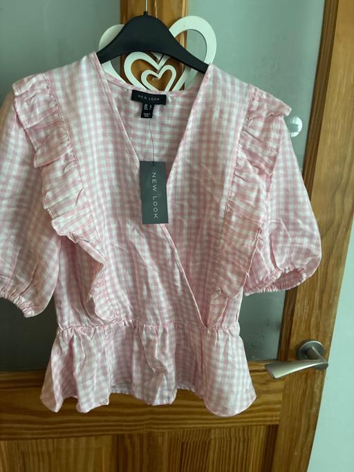  — Pink and white top