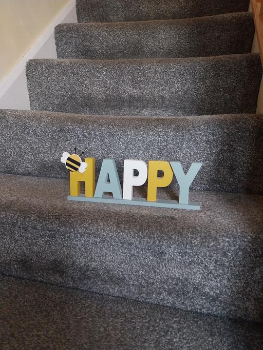  — Standing Happy Word Sign