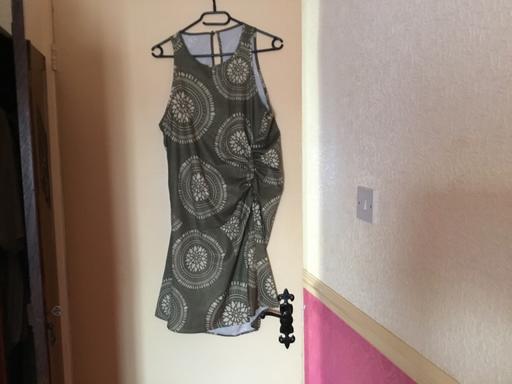  — Ladies Dress Says L more like M