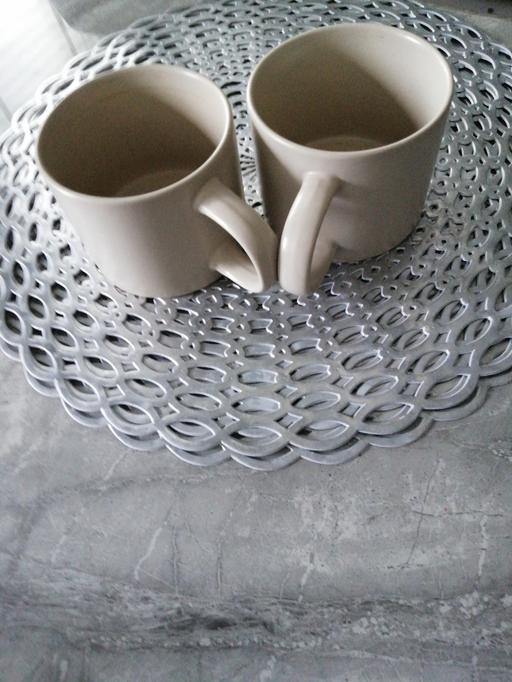  — (2) Mugs