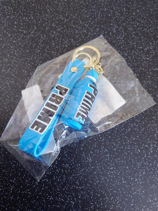  — Blue prime bottle keychain