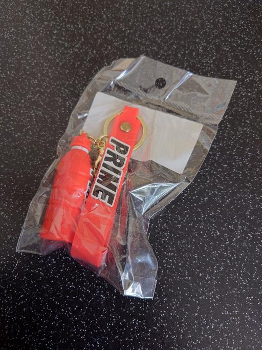  — Red prime bottle keychain