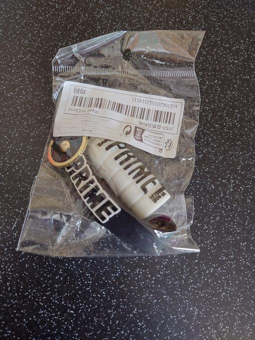  — White prime bottle keychain