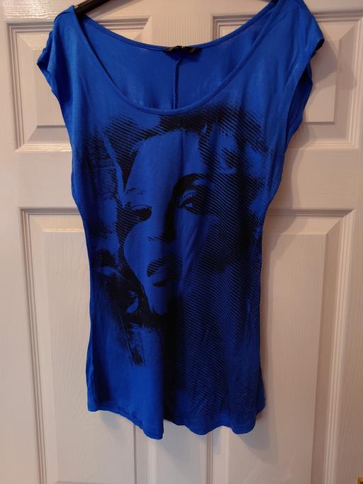  — Women's blue top size 10