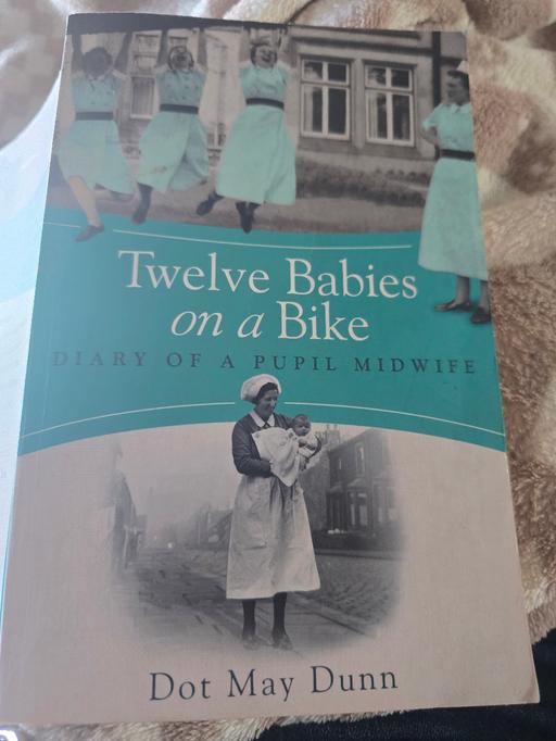  — 12 babies on a bike - paperback - TRUE