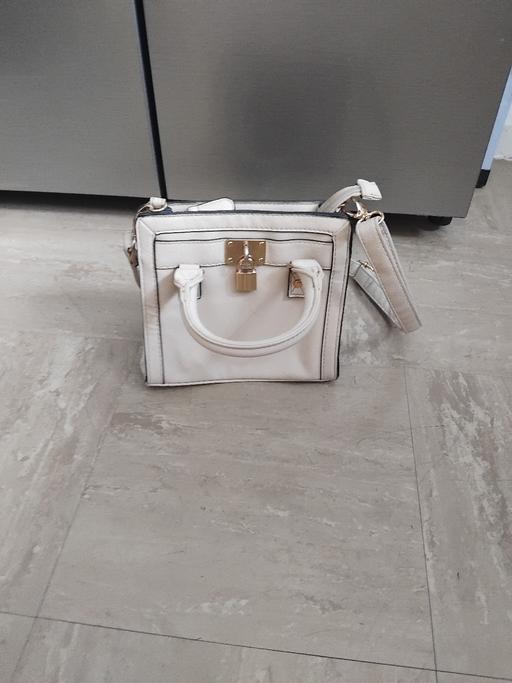  — Handbag.