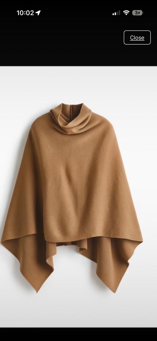  — Roll neck cape