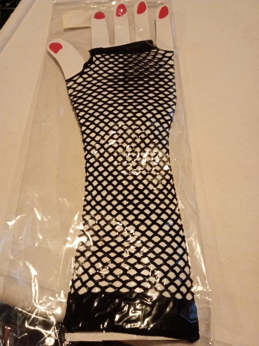  — new pair of ladies fishnet gloves