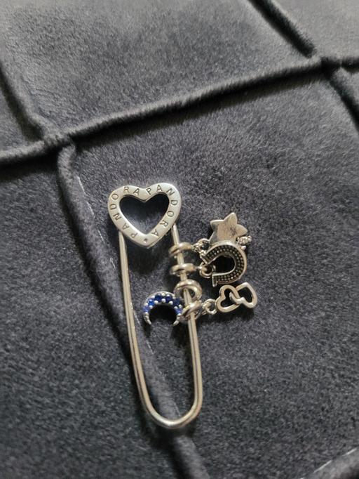  — Pandora Me safety pin brooch decorated with a