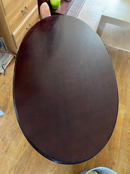  — Solid dark wood table