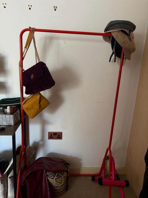  — Orange Clothing Rack