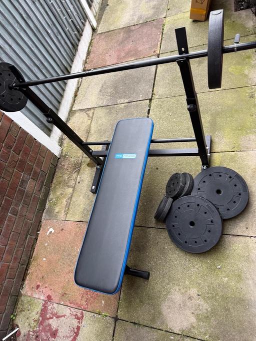  — Weight bench with weight and bar bell