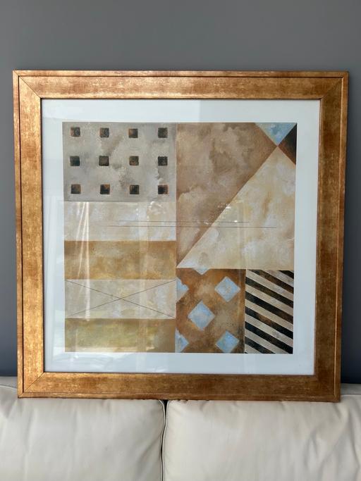  — Gold coloured framed pictures