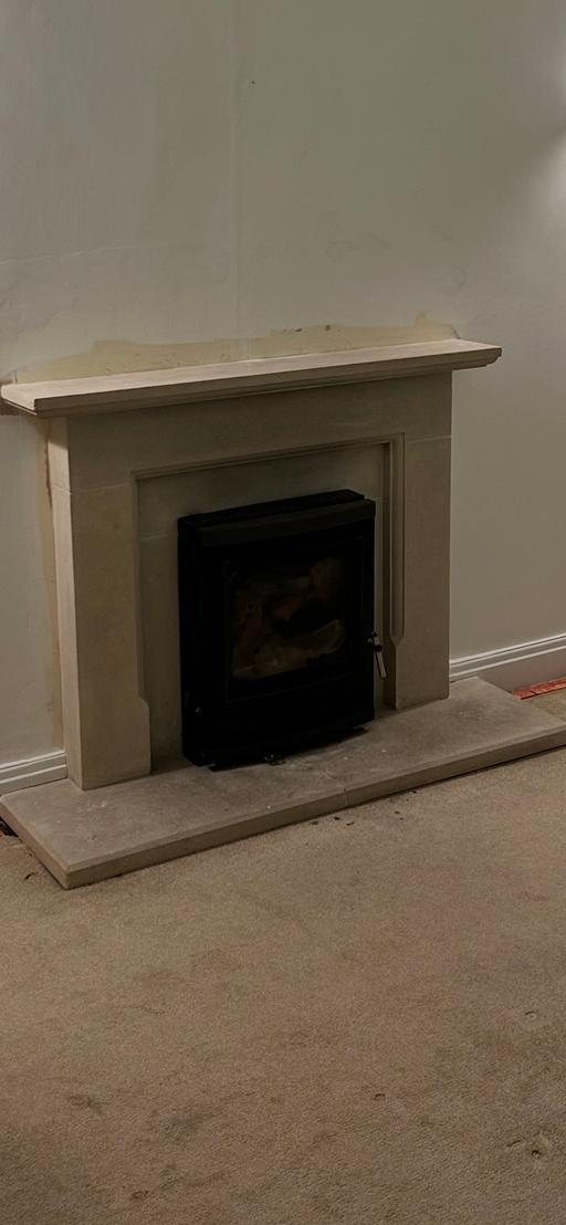  — Limestone fire surround and log burner