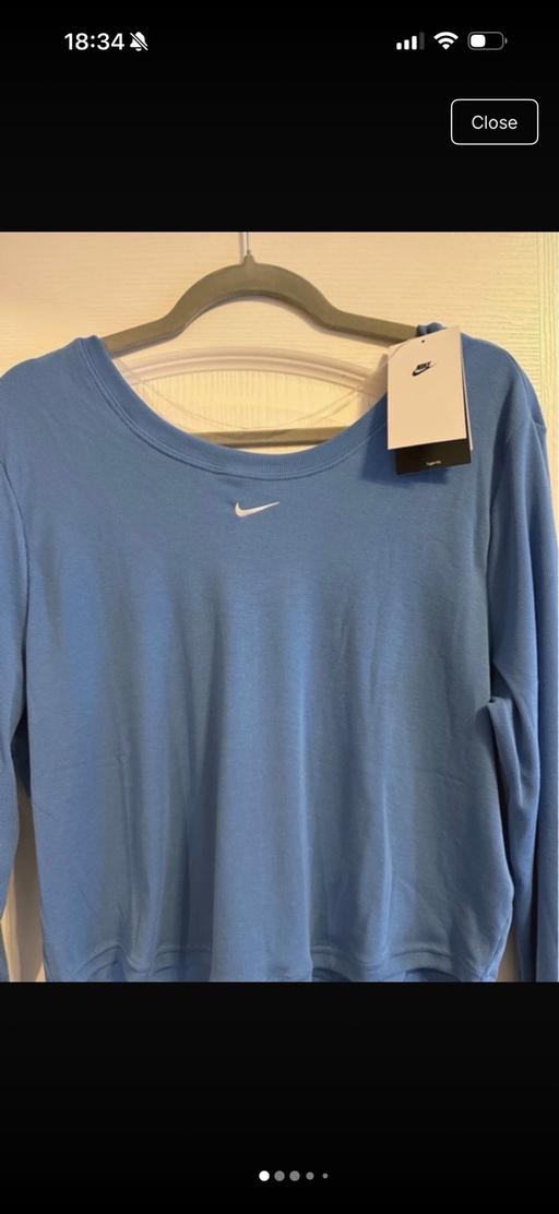  — Nike women’s blue sports top size XL,new