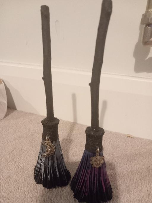  — 2 broomstick statues