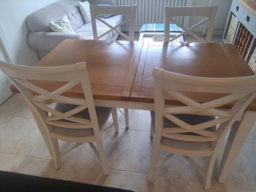  — Extending Dinning table &4 upholstered chair