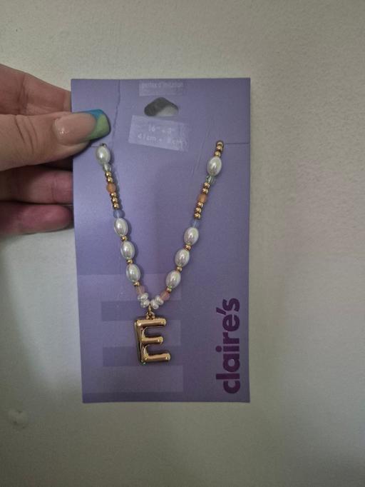  — new Claires E Necklace