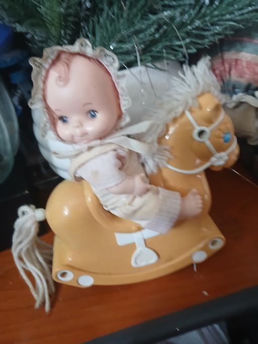  — doll on rocking horse years old