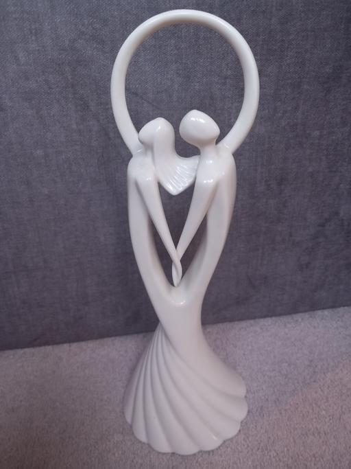  — statue