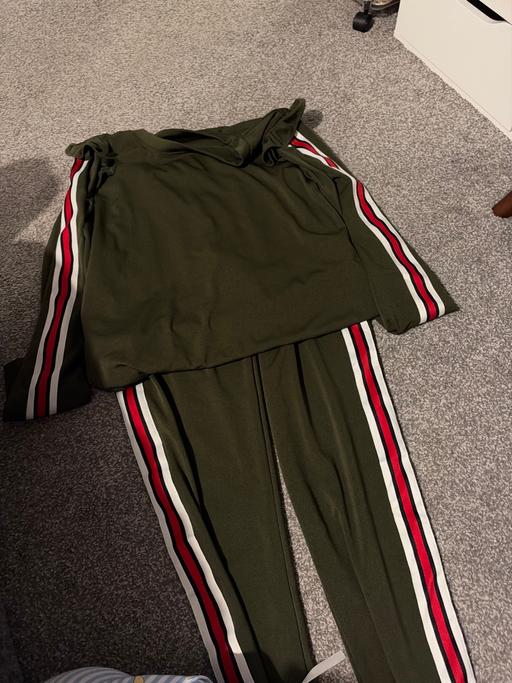  — Green tracksuit
